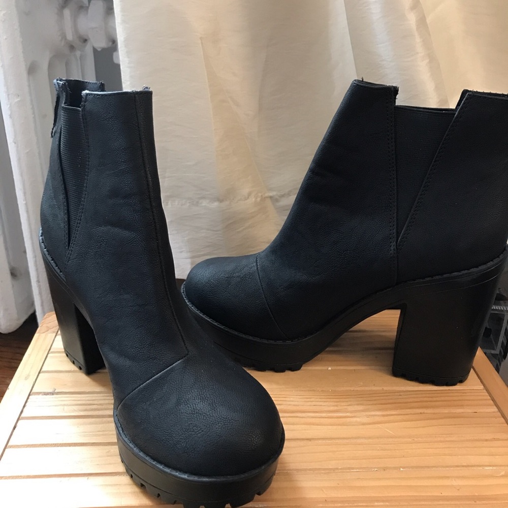 Black leather 4in heel boots. Never Worn!!
